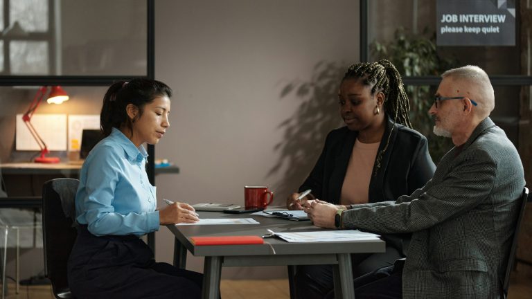 Woman signing a contract for hiring